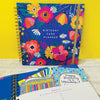 Close-up of wire binding and gold elastic closure on floral greeting card organise