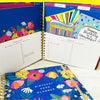 Close-up of wire binding and gold elastic closure on floral greeting card organise