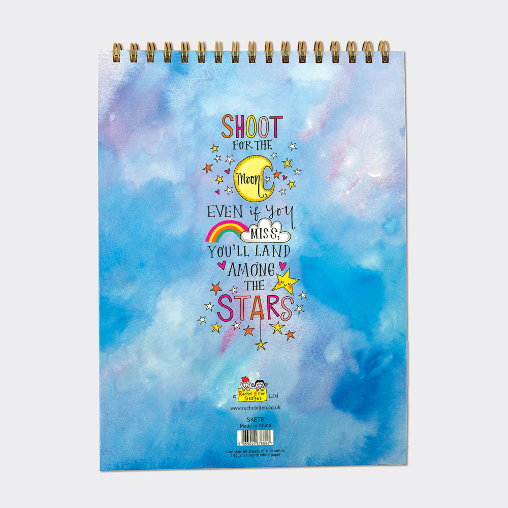 Back of girls art sketchbook with "Shoot for the Moon" quote