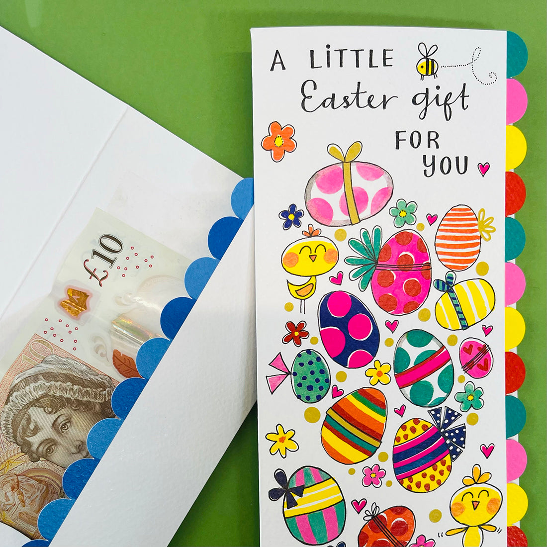 Colourful Easter money wallet card with decorative elements on a green background