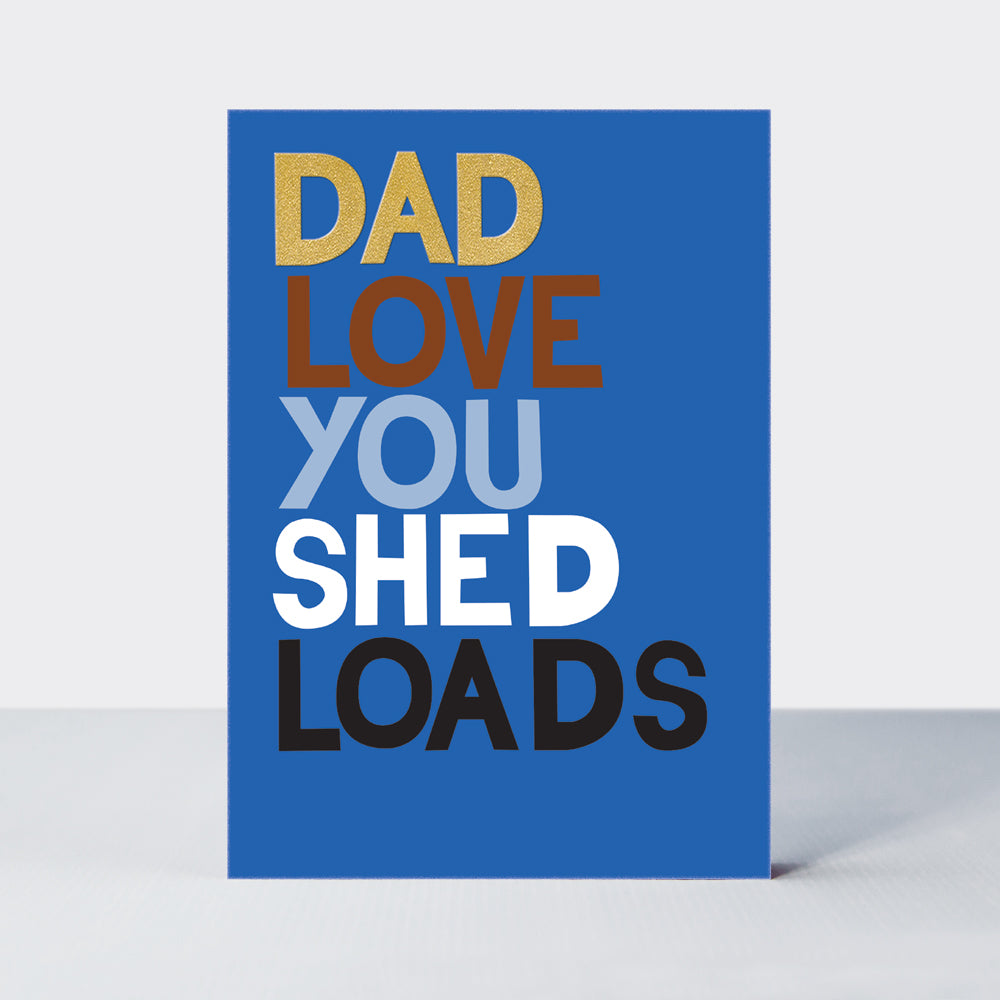 Father's Day Hero card in blue with 'Dad Love You Shed Loads' in bold, multi-coloured lettering and gold foil.