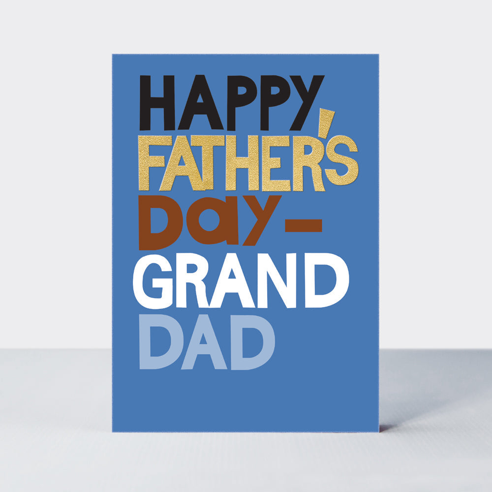 Father's Day Hero card in mid-blue for a grandad with 'Happy Father's Day Grandad' in bold gold foil and white typography.