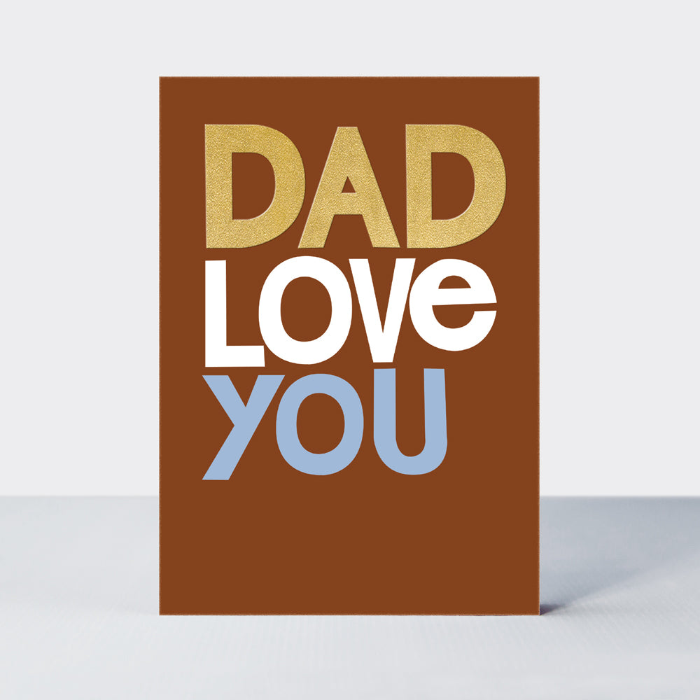Father's Day Hero card in brown with 'Dad Love You' in gold foil and pale blue lettering.